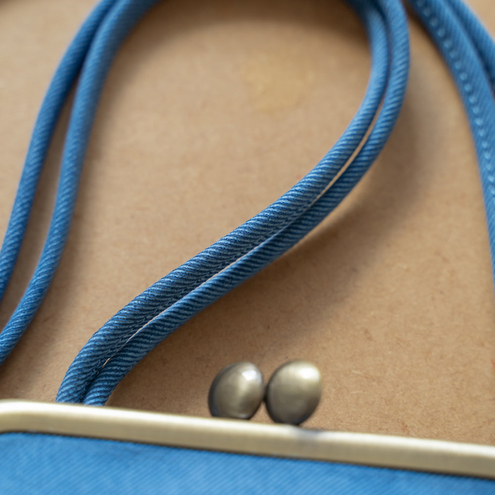 Indigo dyed cowhide clasp pochette (skeleton)